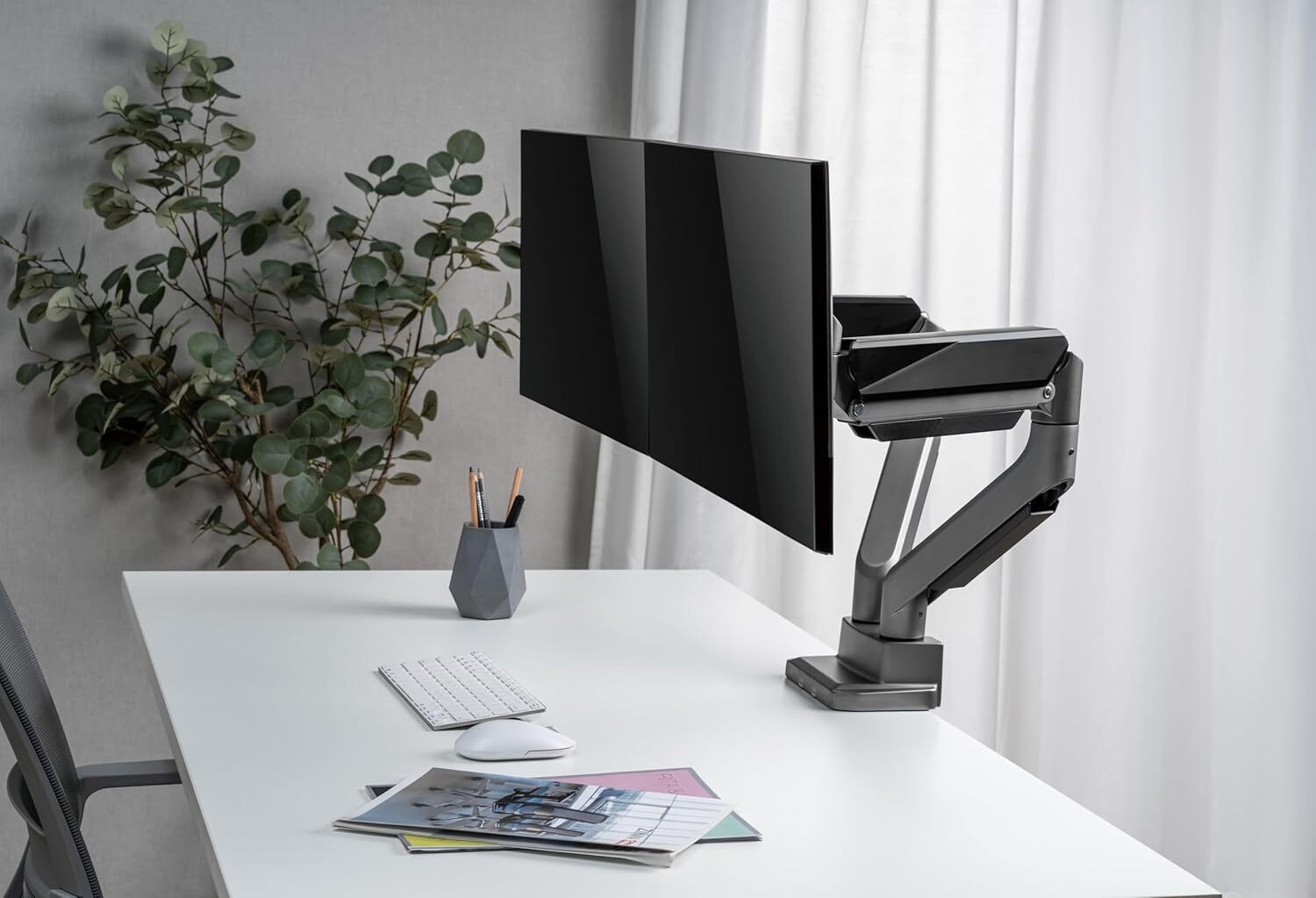 Gas-spring monitor stand arms are the gold standard for executive desks because they allow you to move heavy screens with one finger.